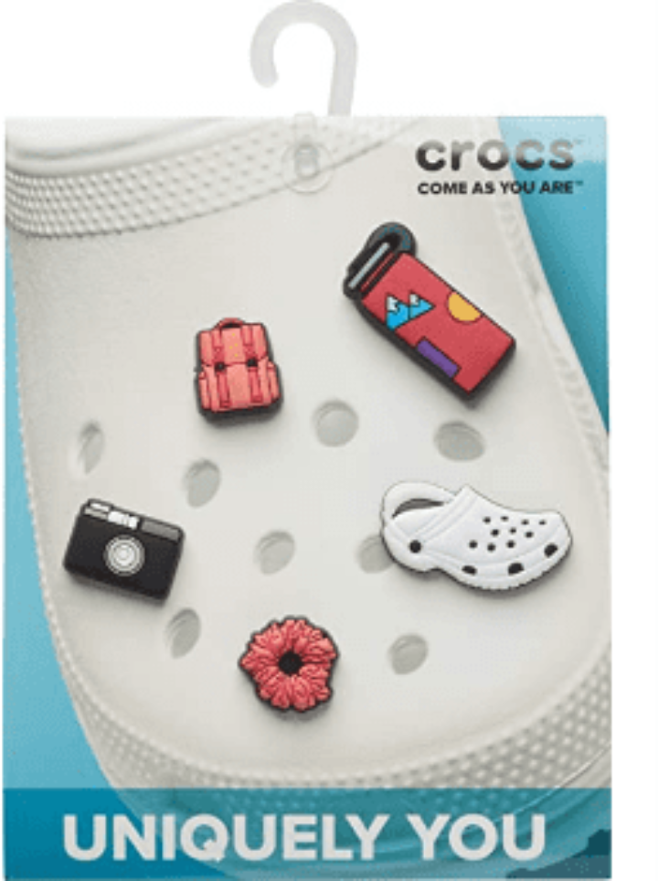 Five colorful Crocs Jibbitz shoe charms in assorted designs on white background
